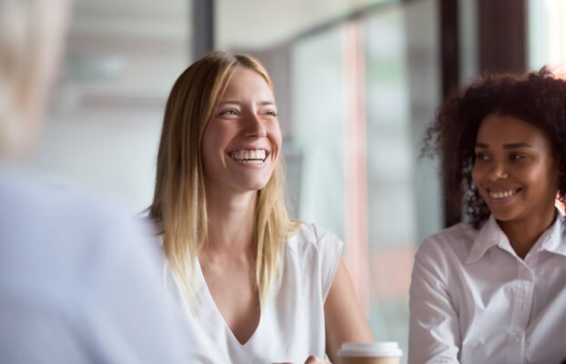 HappyYoungBusinesswomanCoachMentorLeaderLaughingAtFunnyJoke